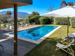 The pool area showing the grassed and decked areas at 215 Mt Buffalo