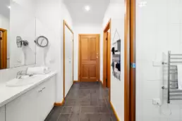 The main bathroom showing the separate vanity area, shower area and toilet 215 Mt Buffalo Pool House. This is a family friendly and pet friendly accommodation option in Porepunkah.