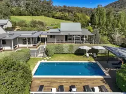 An aerial shot of the house and pool area at 215 Mt Buffalo Pool House. Family friendly and pet friendly accommodation in Porepunkah.