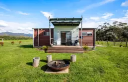 Back exterior and firepit at Feathertop Cottage, at Dreaming of the Buckland, accommodation in the Buckland Valley